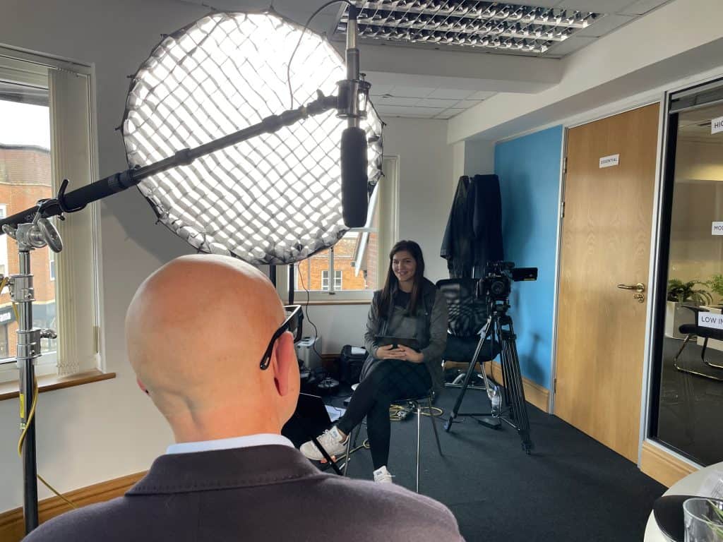 An Example Of A Powdered Head On A Bald Man Under Lights