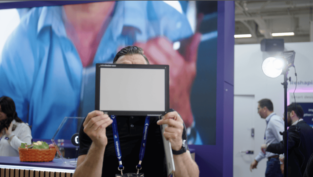 Why Your Video Looks Amazing (And It’s Not Just The Camera!) 2 Jovan Sitting With The Calibrite Colour Checker Facing The Camera With The Colour Side Showing